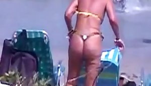 sexy mature thong bikini with NOT her daughter on beach