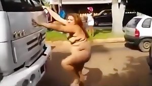 Naked curvy woman on the front of a big truck