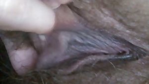 Lustful mature woman playing with her soaking vagina in closeup video