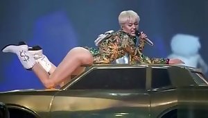 Miley Cyrus slideshow with erotic scenes in revealing outfits