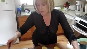 Mature lady spied while baking muffins